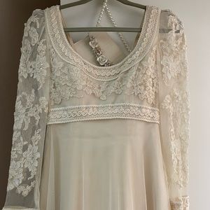 Wedding dress, size small, bedazzled, long train, comes with a purse